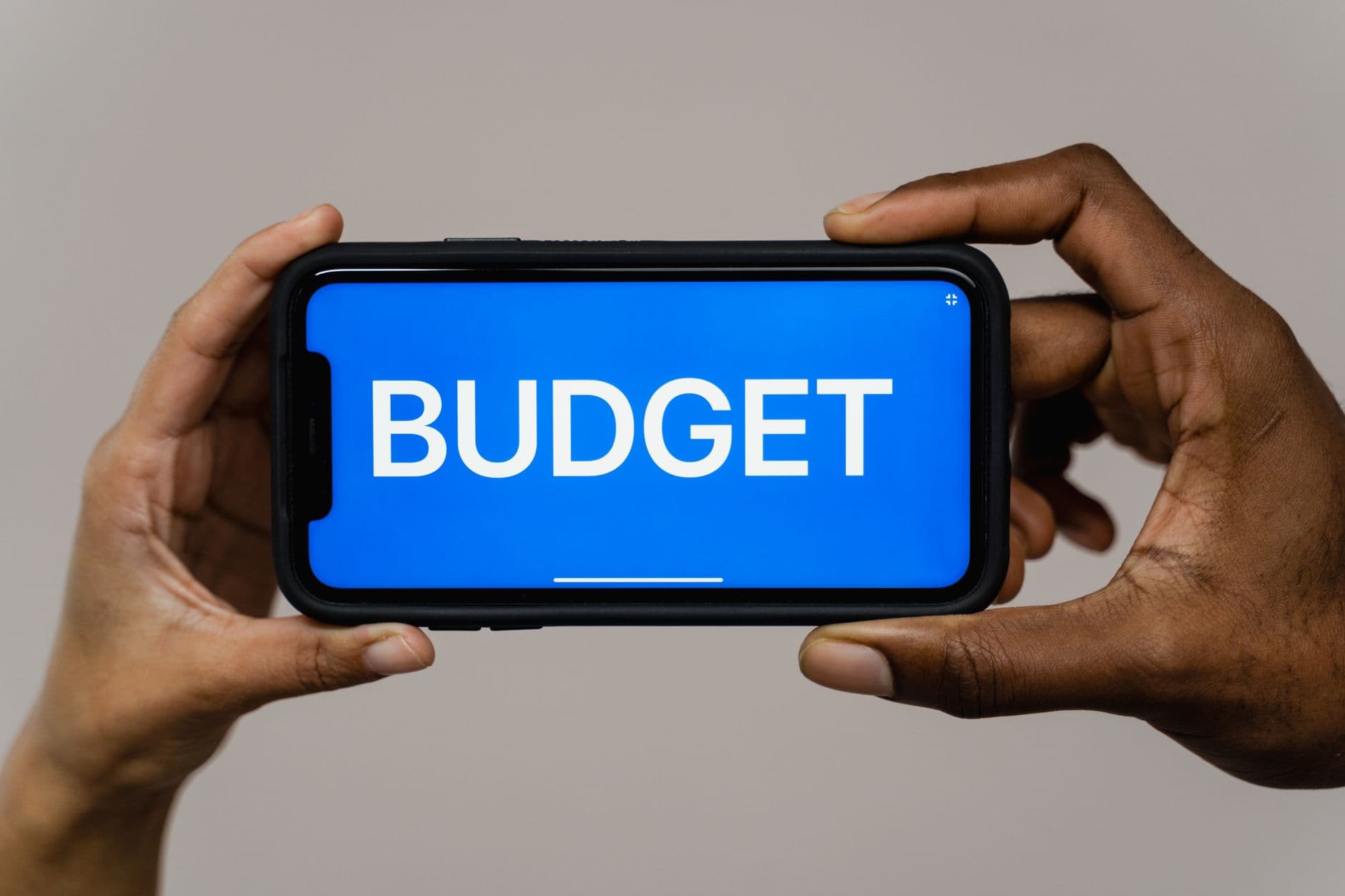 A traveler planning a budget trip on a phone, illustrating the cheapest travel eSIM in 2026.