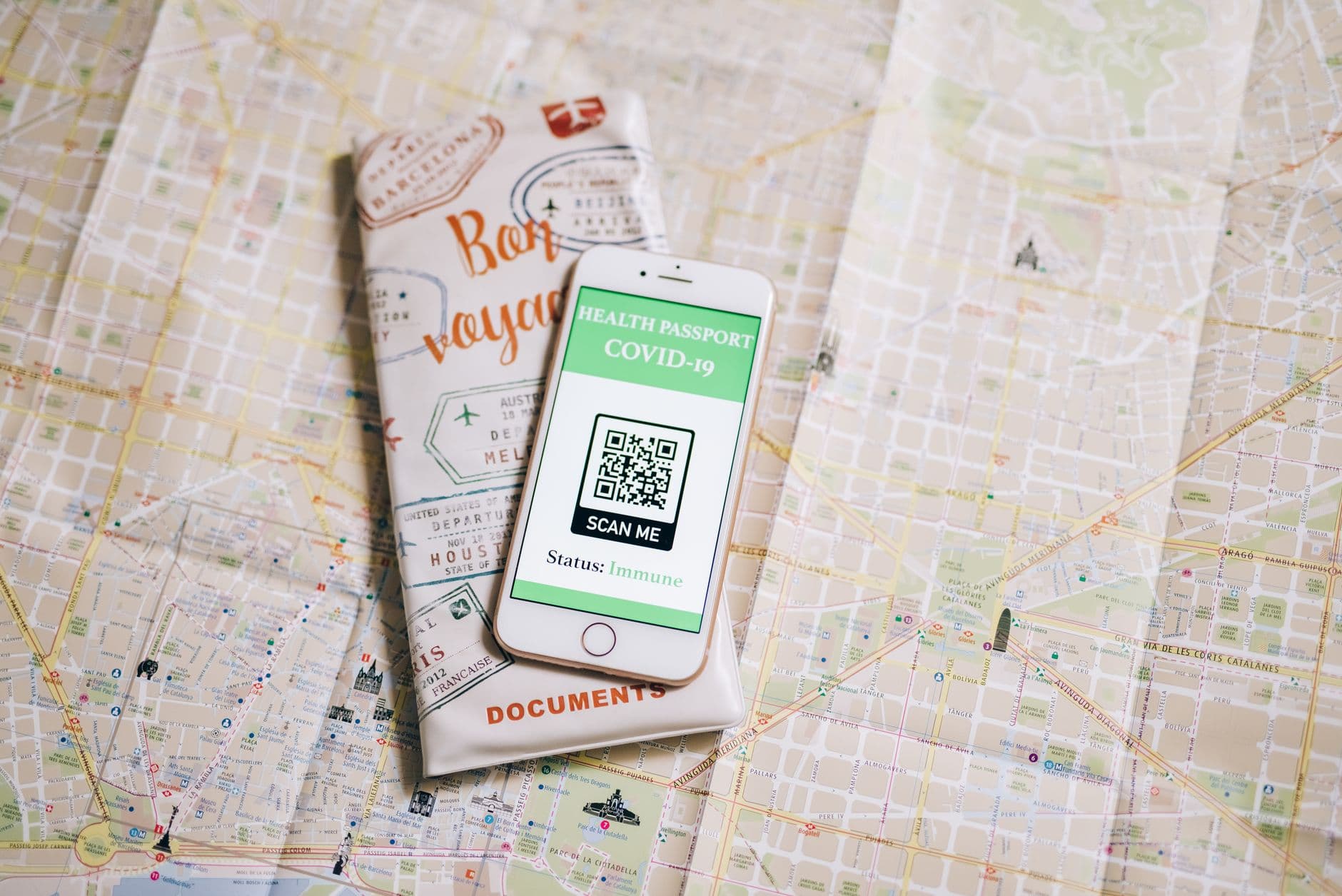 A smartphone camera pointed at a QR code displayed on another screen, illustrating the eSIM QR code scanning process.