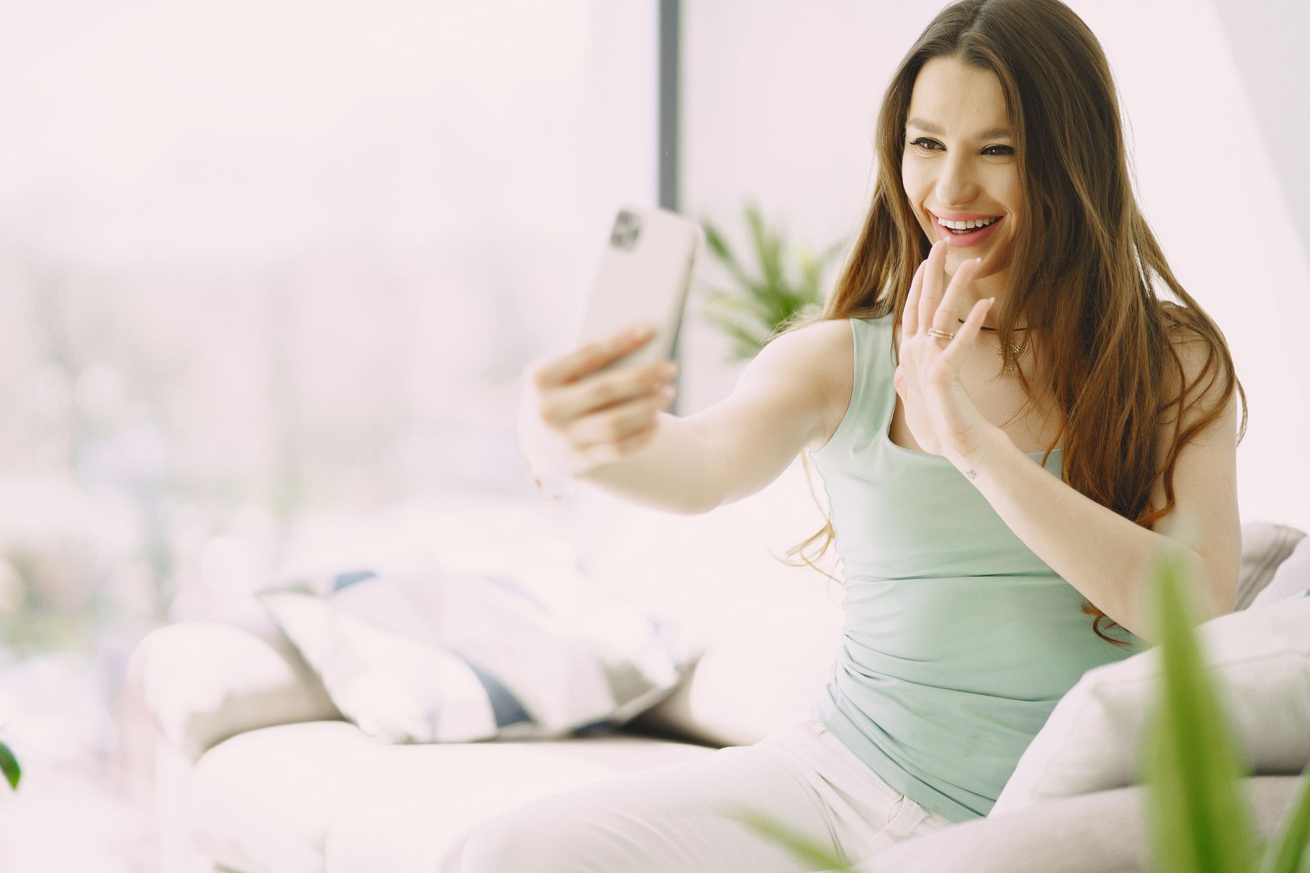 A traveler streaming on her phone abroad, illustrating a cheaper Holafly alternative for unlimited data.