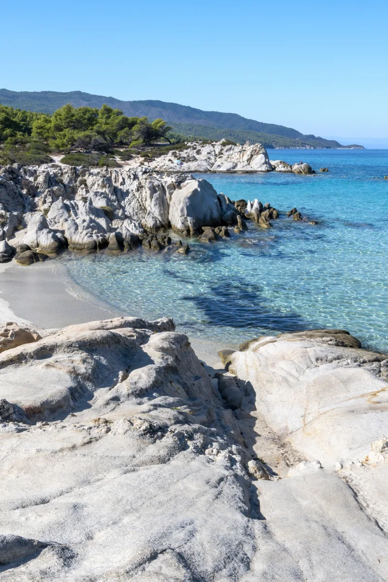 Golden sandy beach in Spain with waves gently reaching the shore