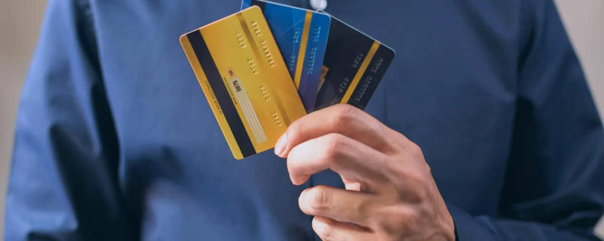 Best travel credit cards in hand, symbolizing travel perks, rewards, and financial readiness for global trips.