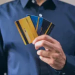 Best travel credit cards in hand, symbolizing travel perks, rewards, and financial readiness for global trips.