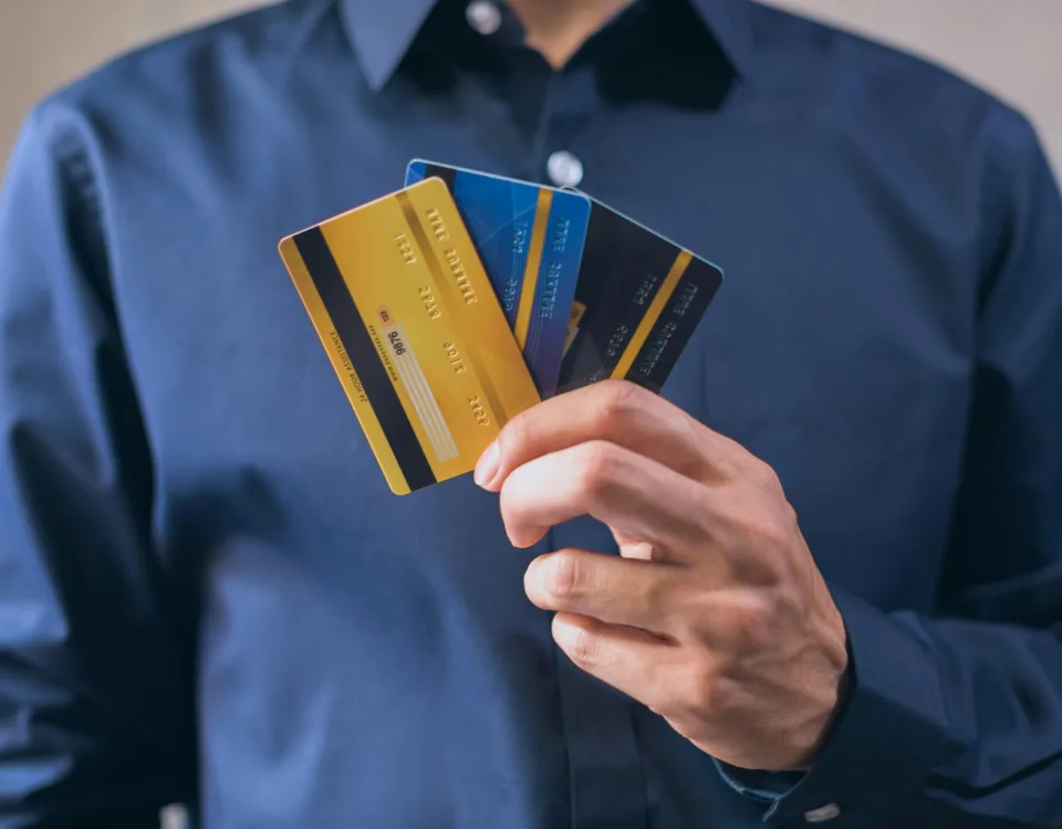Best travel credit cards in hand, symbolizing travel perks, rewards, and financial readiness for global trips.