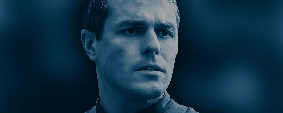 Dave Register in a dramatic close-up with cool blue tones and serious expression.