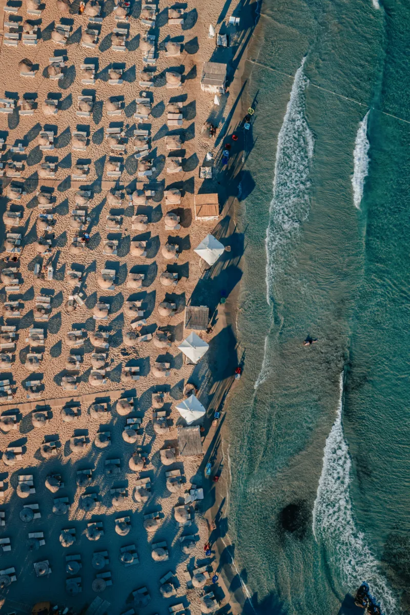 La Pelosa Beach Sardinia Italy with shallow turquoise water, soft white sand.